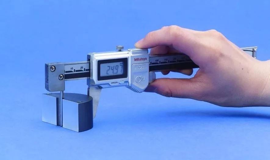 inspection of machined part with caliper or CMM